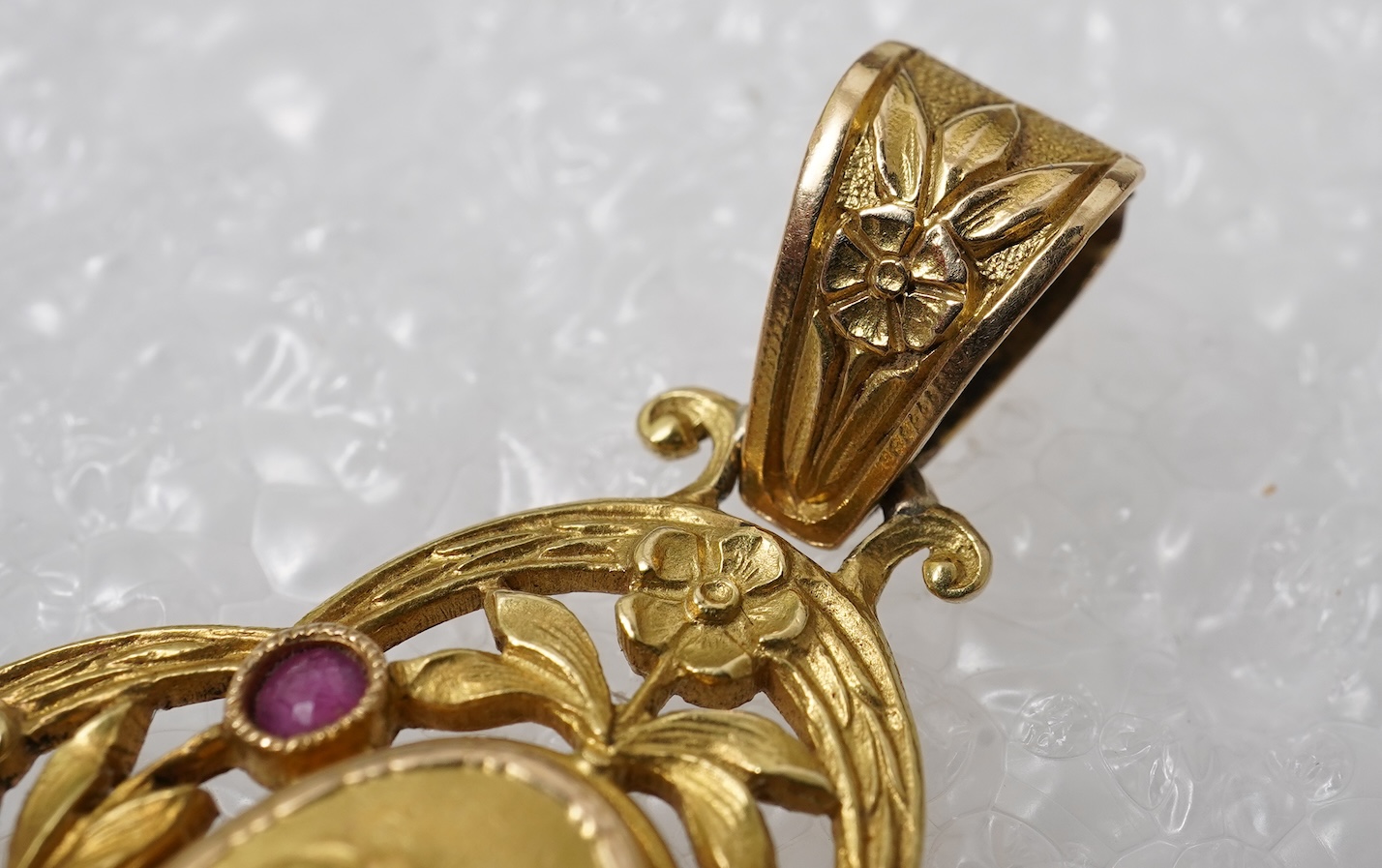 An Art Nouveau ruby and diamond locket pendant, France, circa 1900